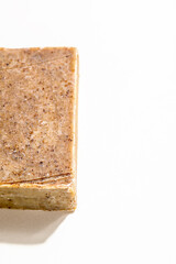 A handmade organic bar of soap on white background close-up. Spa natural treatments products. Vertical orientation