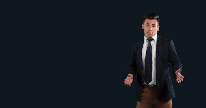 Young Caucasian businessman talking on black background