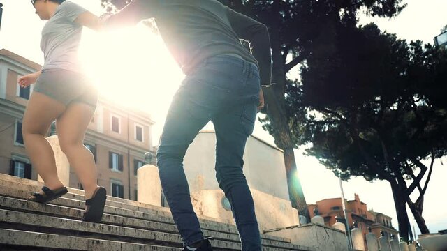 young black man trying to stop his girlfriend who is leaving after an argument