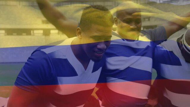 Animation of a Colombian flag waving over multi-ethnic male rugby team standing in a row