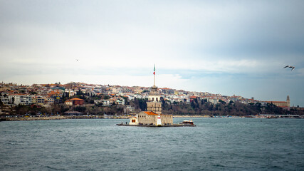 Obraz premium Istanbul - Turkey - 01/24/2019: Maiden's Tower is the most commonly visited tourist attraction located in the Bosphorus.