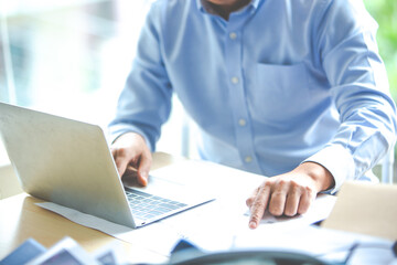 planning, meeting, appointments concept. Closeup hand of business man putting pins on calenda for scheduling and booking appointment or meeting