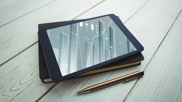 Animation of a digital tablet lying on a notebook with graphs and statistics on the screen