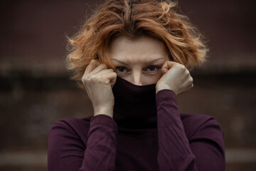 beautiful woman with short hair wearing black turtleneck