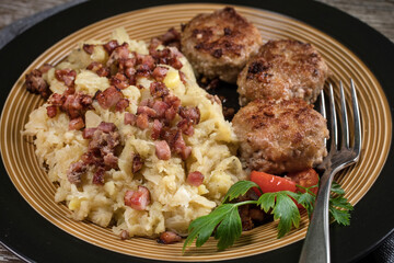Minced meat cutlets with boiled sauerkraut.