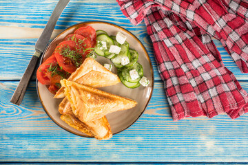 Sandwiches with cheese, tomatoes and cucumber.