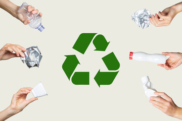 Hands hold trash on a light background. Recycling sign. The concept of separate trash, stop...