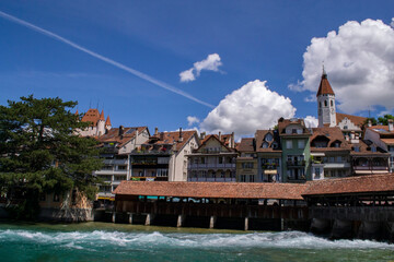 Fototapeta na wymiar view of the Thun Castle in Switzerland in Thun, as well as beautiful houses by the river