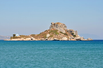 Fototapeta na wymiar A small chapel on a rocky island in the Mediterranean