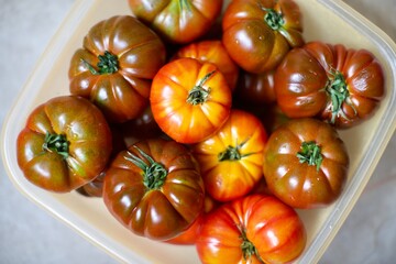 Close-up view of fresh tomatoes. Organic tomatoes grown in the village and standing in the basket. 