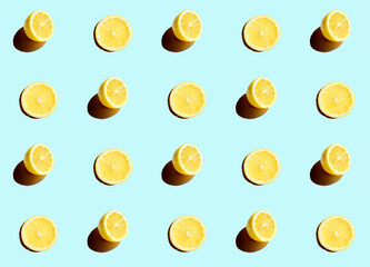 Series of half cut lemons on a blue background