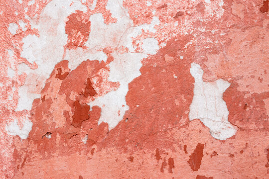 pink texture of an old wall. vintage background of dirty rough plaster