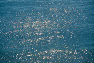 Blue sea water surface with waves, top view