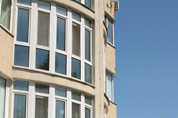 windows of office building and blue sky