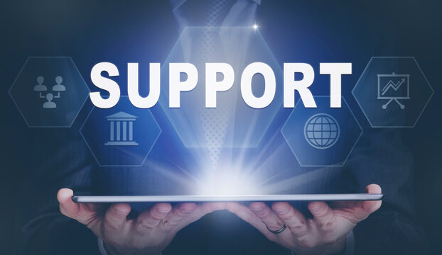 Businessman holding a computer tablet display projecting a Support concept.