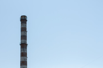 factory chimney against blue sky
