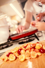 cooking and baking cherry pie with almond slices