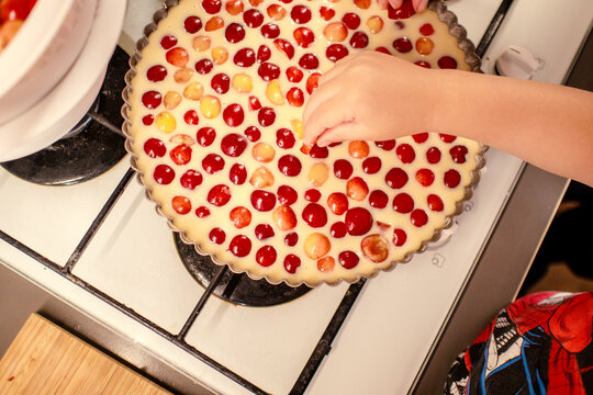 cooking and baking cherry pie with almond slices