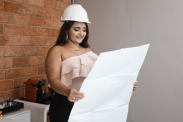 young woman architect working in her office