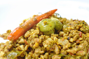 fried minced pork with flat bean in yellow curry on plate