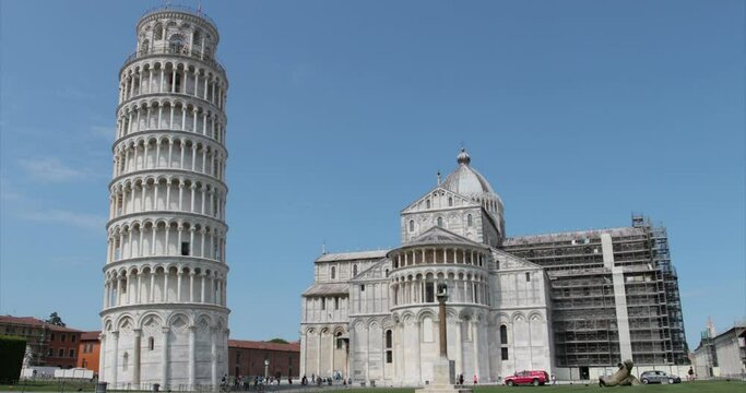 timelapse 4k, the leaning tower and the cathedral with scaffolding for restoration in Piazza dei Miracoli in Pisa.