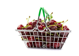 Ripe cherries in a basket on a white background