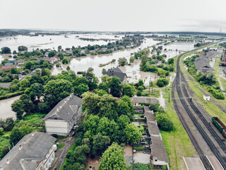 View of the railway track and the flooded city. Natural disaster in Ukraine. Roads, streets and houses are flooded with dirty water