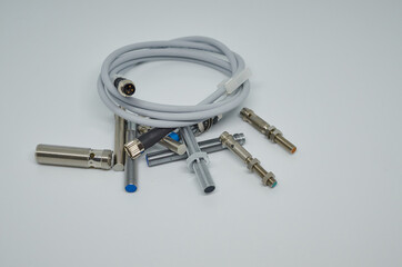 Many Inductive proximity sensor or proximity switch on a white background.