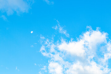 light blue sky with clouds with a mood