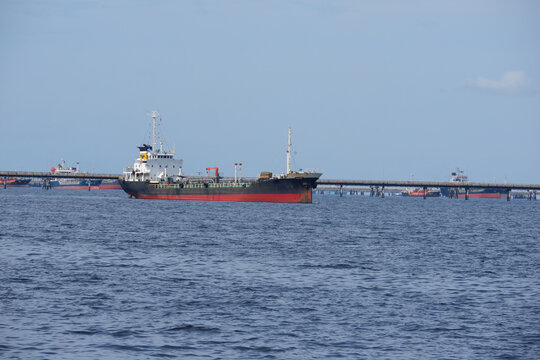 The oil tanker in the back is the harbor crane