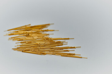 Potentiometers stand on the gray background. Many Potentiometers. Macro close up of electronic...