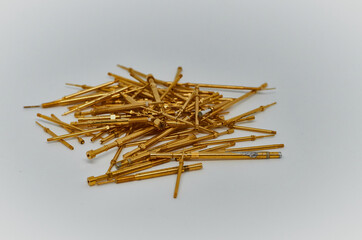 Potentiometers stand on the gray background. Many Potentiometers. Macro close up of electronic component potentiometer