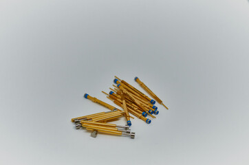 Potentiometers stand on the gray background. Many Potentiometers. Macro close up of electronic component potentiometer