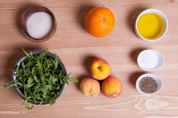 Ingredients for a peach salad with arugula