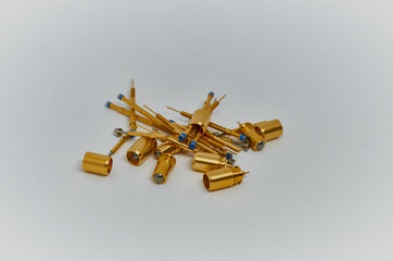 Potentiometers stand on the gray background. Many Potentiometers. Macro close up of electronic component potentiometer