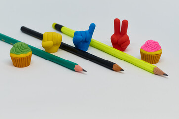 Pencil with pencil shavings and sharpener with eraser