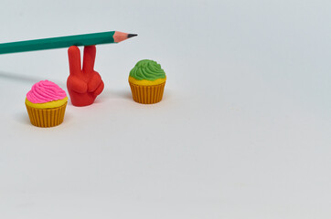 Pencil with pencil shavings and sharpener with eraser
