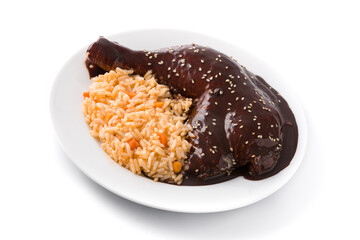 Traditional mole Poblano with rice in plate isolated on white background