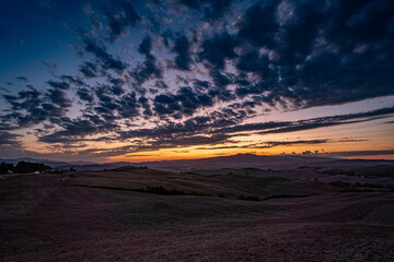 Tuscany sunset Fall fields clouds purple blue yellow 