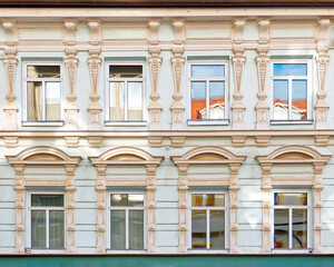 vintage building decorated facade with regular windows pattern