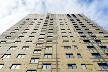 cladding of a multi-storey building with insulation, construction of a house, exterior decoration...