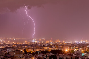 Naklejka na ściany i meble Lightning storm strikes the city of Thessaloniki, Greece