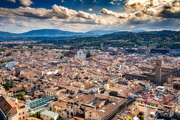 Panoramic view, aerial skyline of Florence Firenze on blue backdrop with dramatic sky 