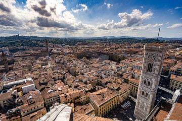 Panoramic view, aerial skyline of Florence Firenze on blue backdrop with dramatic sky 