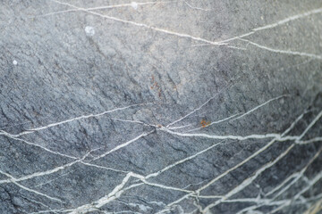 Fototapeta na wymiar Abstract background and texture of gray stone and white stripes. Pattern line of the rock