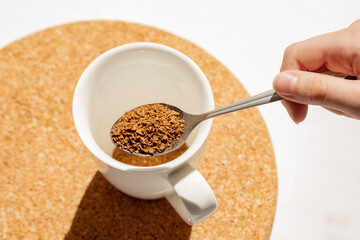 brew instant coffee, granulated coffee in a teaspoon, have a cup of coffee for breakfast