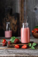 Strawberry milkshake in the glass jar.  Strawberry smoothie, healthy food for breakfast and snack