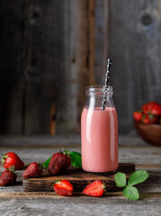 Strawberry milkshake in the glass jar.  Strawberry smoothie, healthy food for breakfast and snack