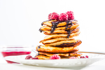 Cottage cheese pancakes with fresh raspberry and chocolate sirup