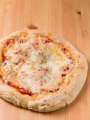 Cheese Pizza on a wooden table